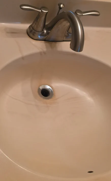 After: Bathroom sink before and after cleaning