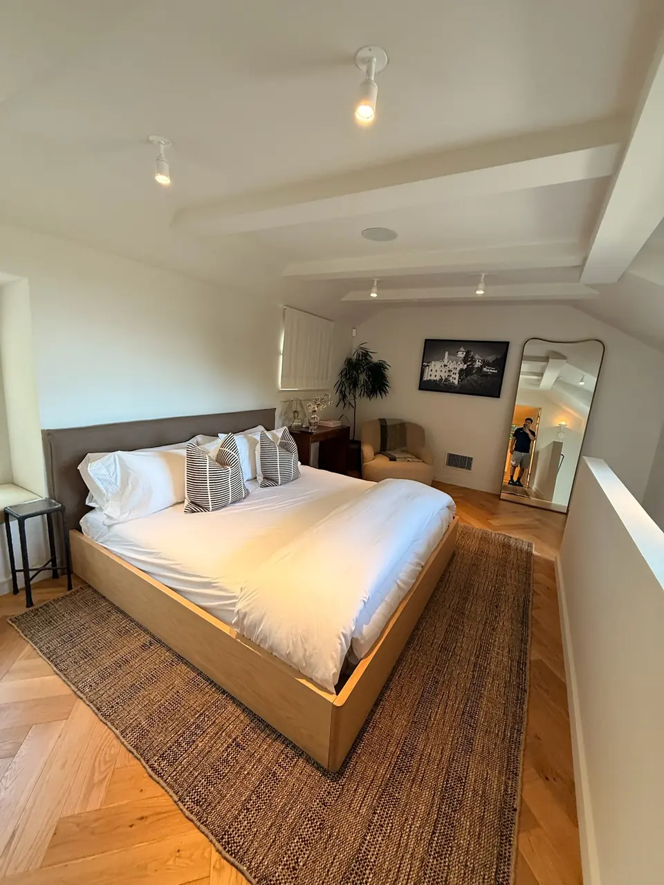 Loft bedroom with a beamed ceiling