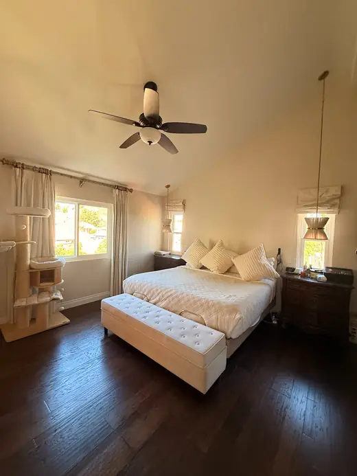 Bedroom with dark hardwood floors