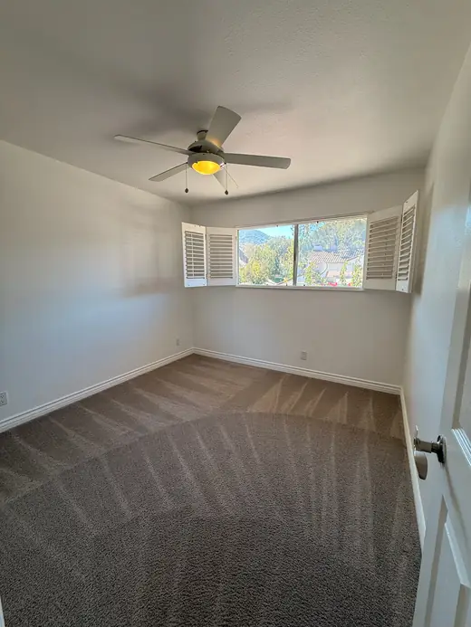 Freshly cleaned carpet in an empty bedroom