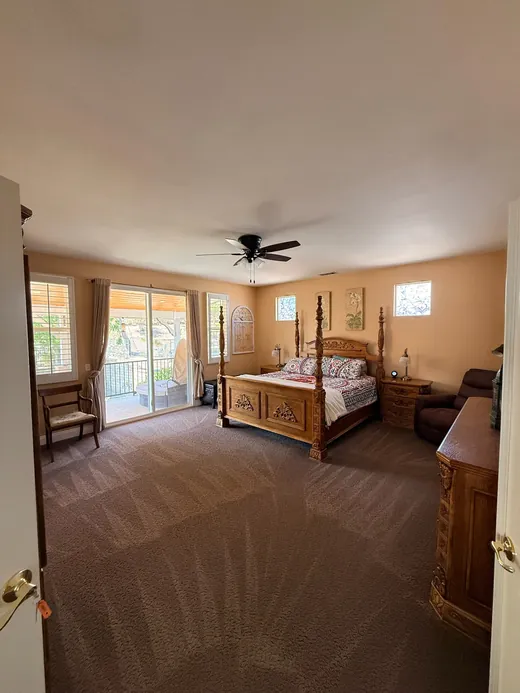 Cleaned carpet in a bedroom with a carved four-poster bed