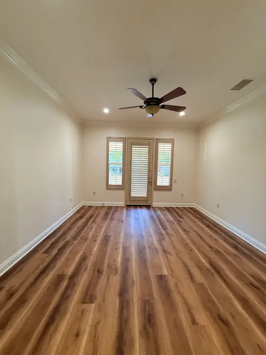 Empty room with crown molding and clean floors